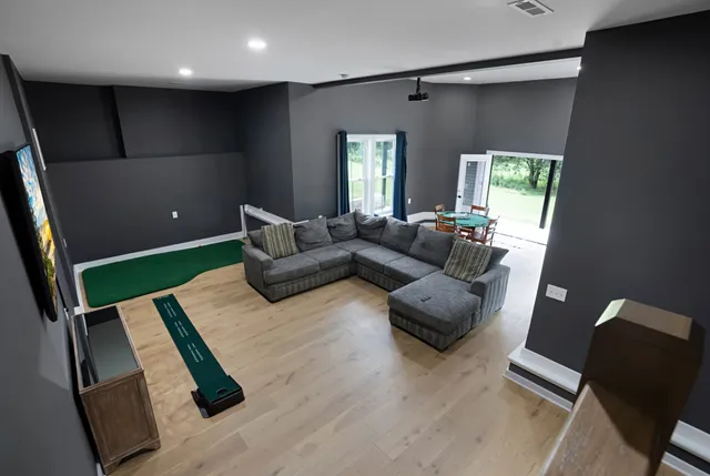 a living room with furniture and a flat screen tv