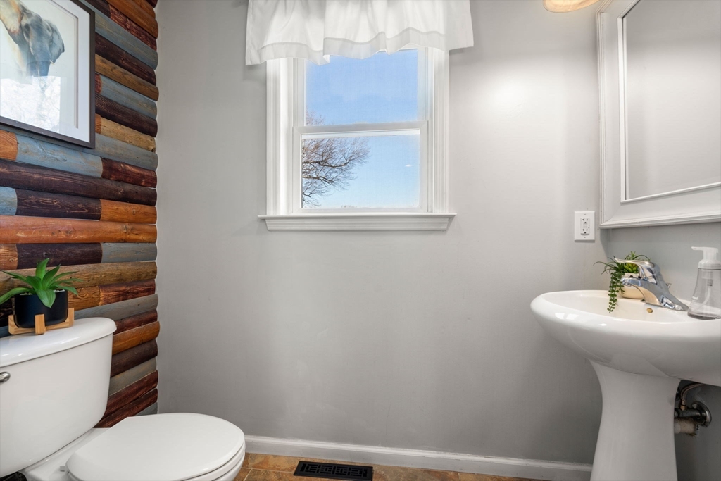 12 Silvermine Road Woburn, MA 01801 - Photo 11 of 36 a bathroom with a sink mirror and toilet