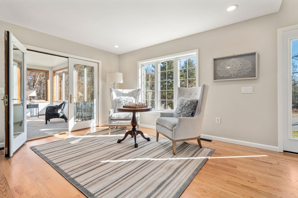 12 Silvermine Road Woburn, MA 01801 - Photo 15 of 36 a living room with furniture a rug wooden floor and a large window