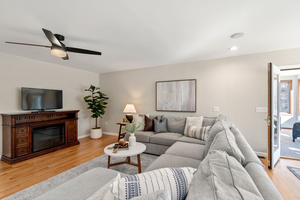 12 Silvermine Road Woburn, MA 01801 - Photo 16 of 36 a living room with furniture and a fireplace