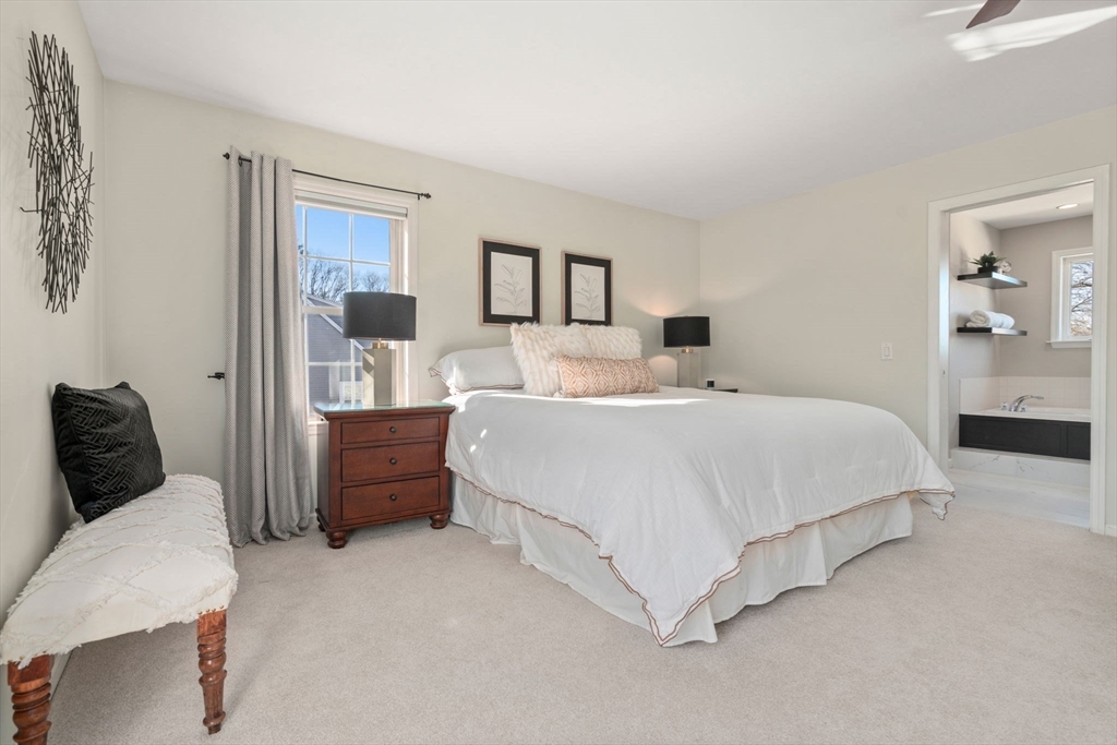 12 Silvermine Road Woburn, MA 01801 - Photo 22 of 36 a bedroom with a large bed and a chair