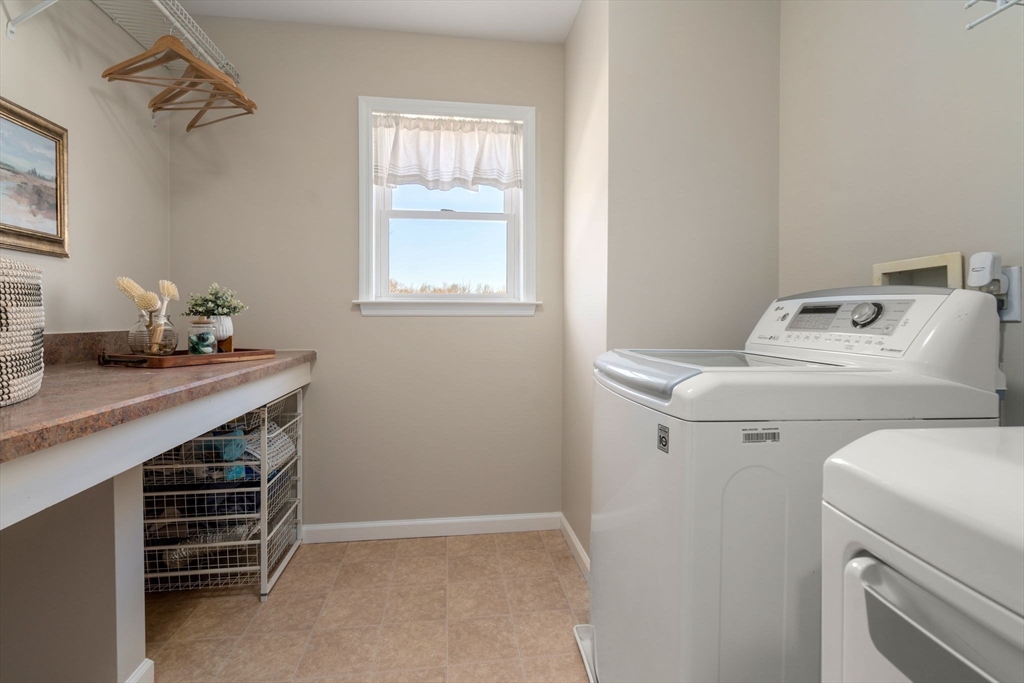 12 Silvermine Road Woburn, MA 01801 - Photo 32 of 36 a utility room with dryer and washer