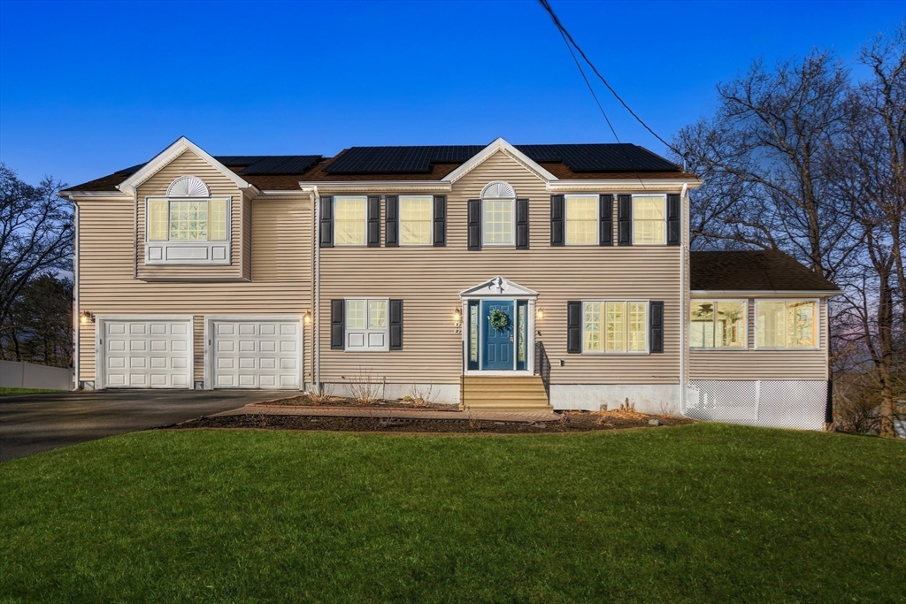 12 Silvermine Road Woburn, MA 01801 - Photo 4 of 36 a front view of a house with a yard