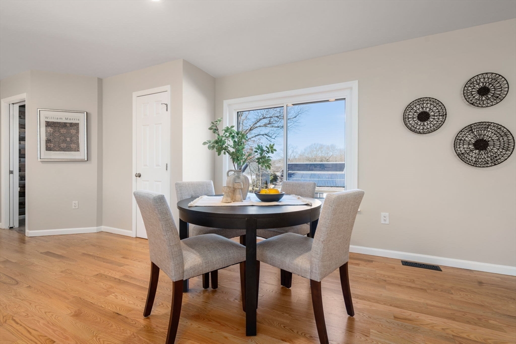 12 Silvermine Road Woburn, MA 01801 - Photo 10 of 36 a view of a dining room with furniture and wooden floor