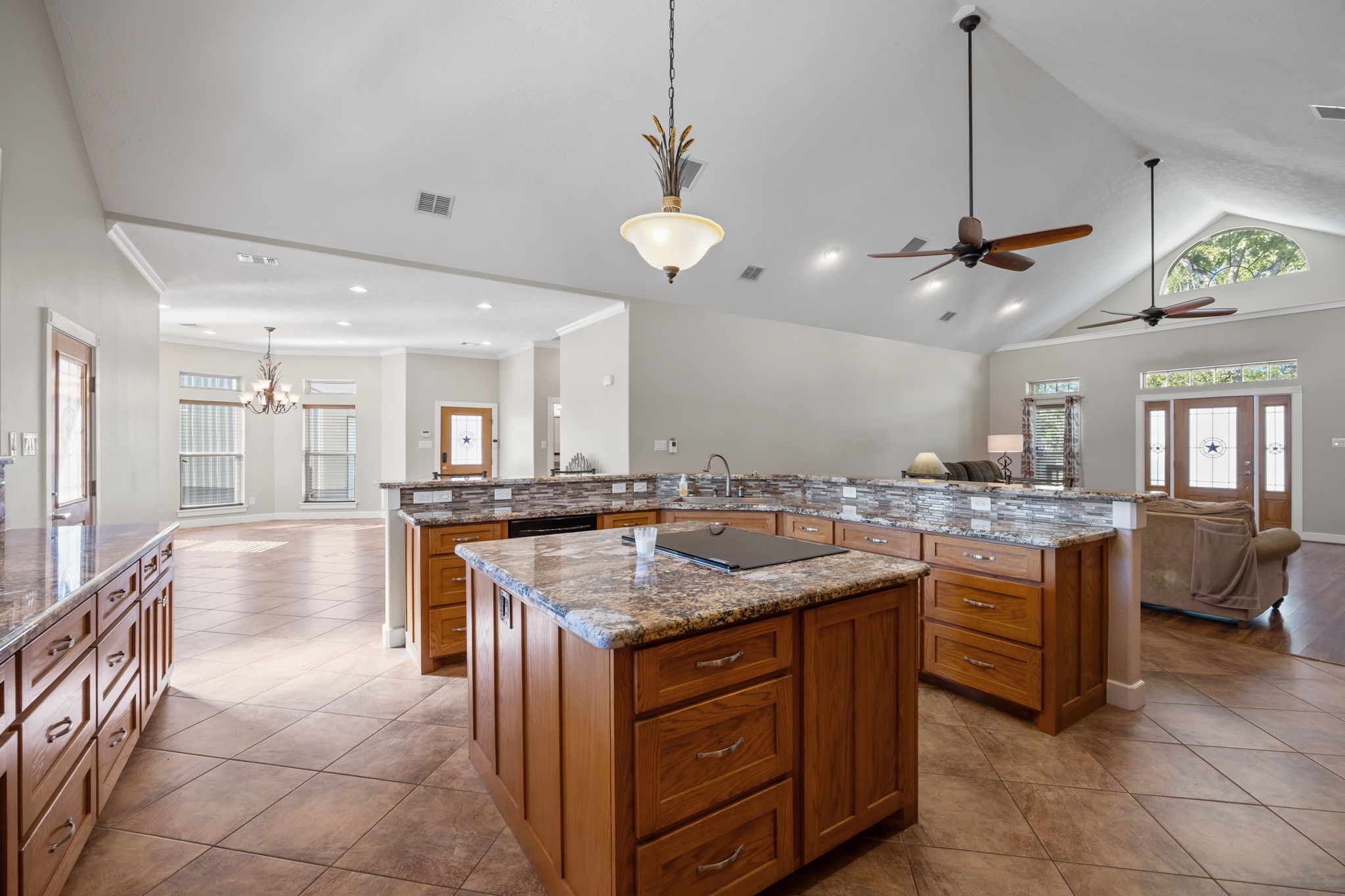 3998 County Road 612 Angleton, TX 77515 - Photo 16 of 47 a kitchen with a counter top space appliances and a ceiling fan