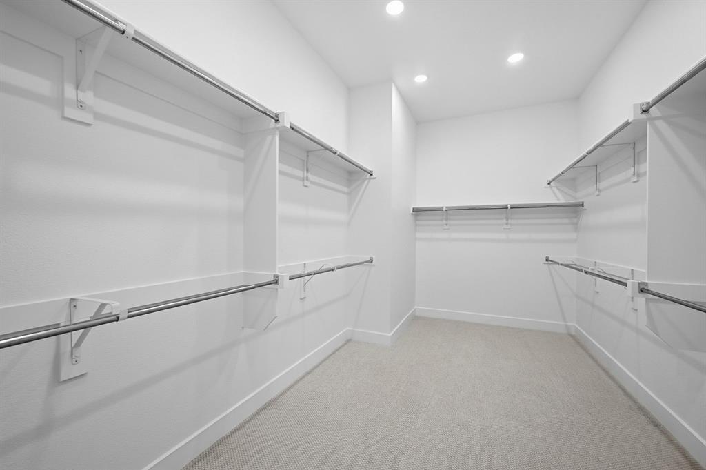 571 Twilight Drive Prosper, TX 75078 - Photo 16 of 30 a view of a room with racks on the wall