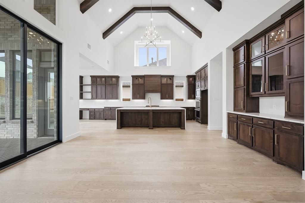 571 Twilight Drive Prosper, TX 75078 - Photo 24 of 30 a large white kitchen with a large window
