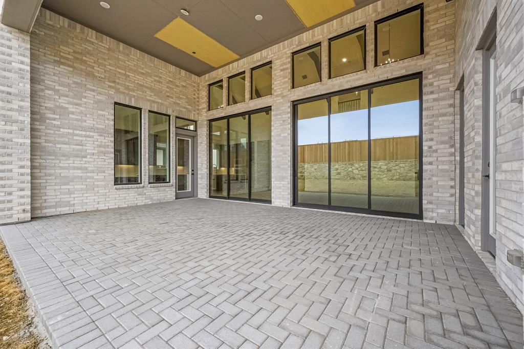 571 Twilight Drive Prosper, TX 75078 - Photo 29 of 30 a view of a brick house with a large window