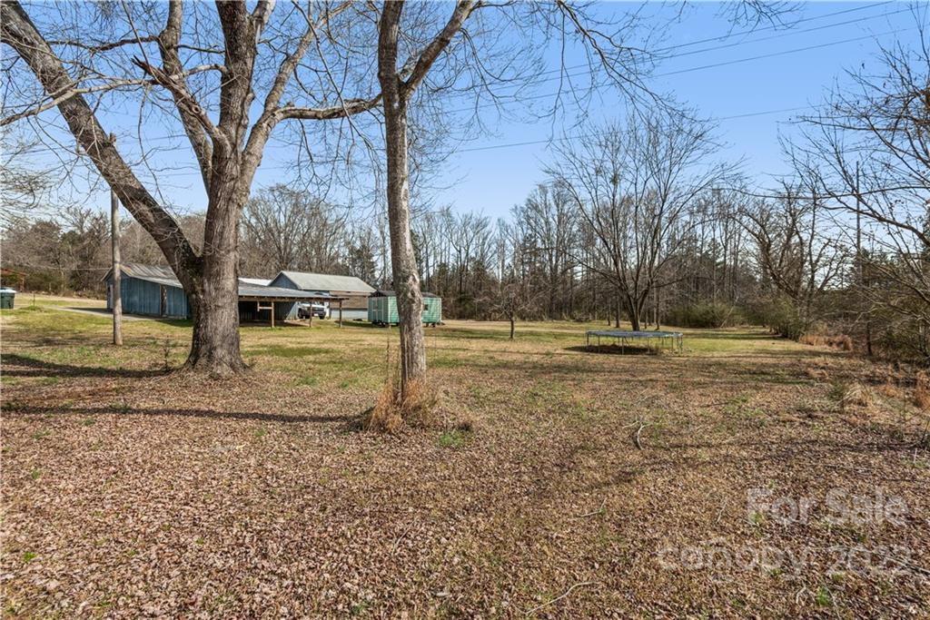 4600 Stallings Road Matthews, NC 28105 - Photo 6 of 38 a backyard of water with tall trees
