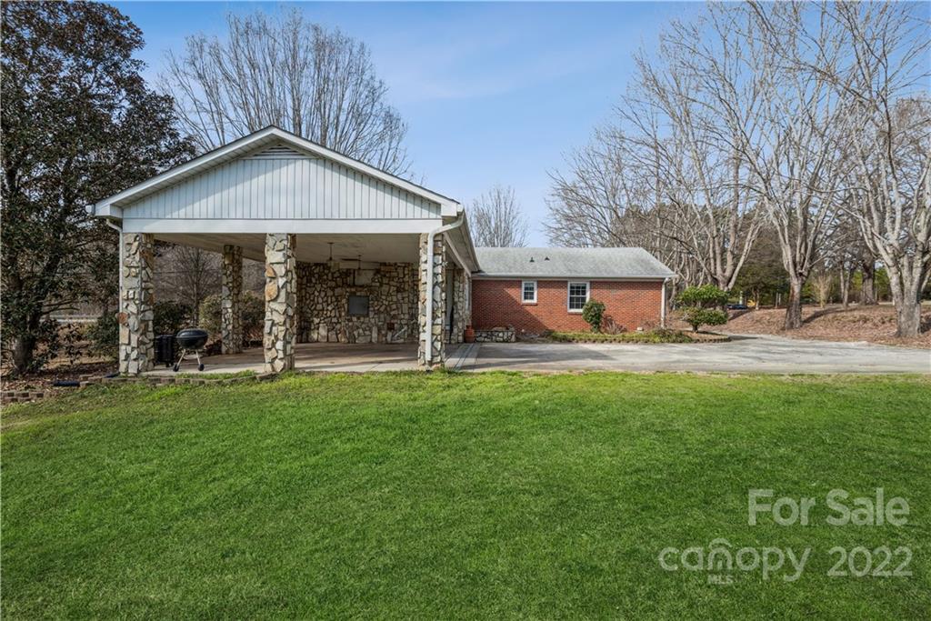 4600 Stallings Road Matthews, NC 28105 - Photo 7 of 38 a front view of a house with a yard