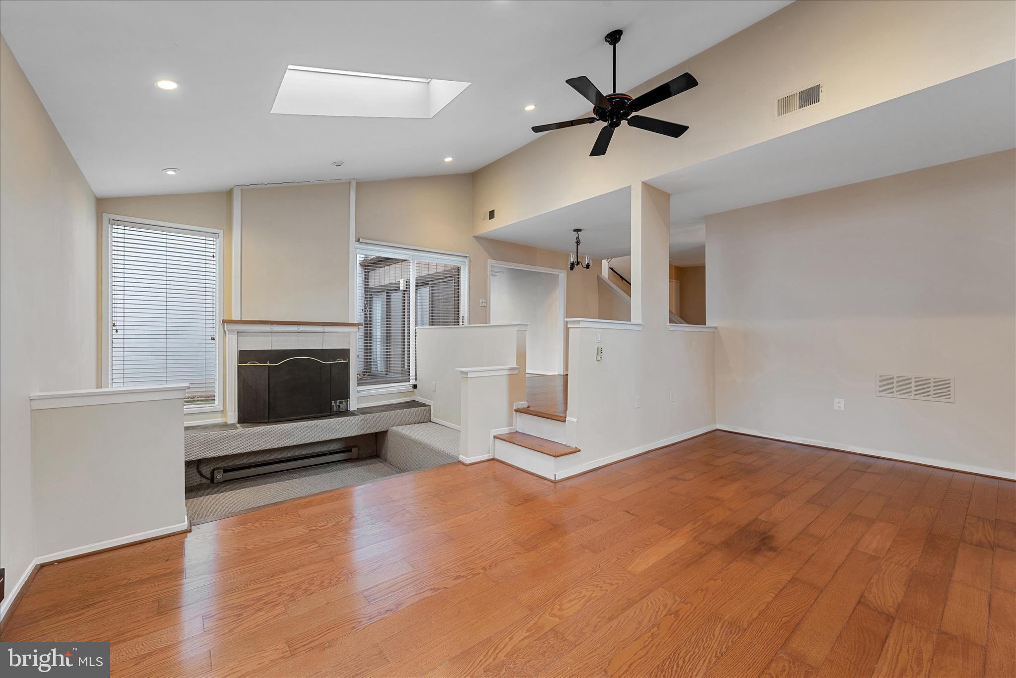 2337 Glade Bank Way Reston, VA 20191 - Photo 20 of 50 a living room with furniture and a fireplace