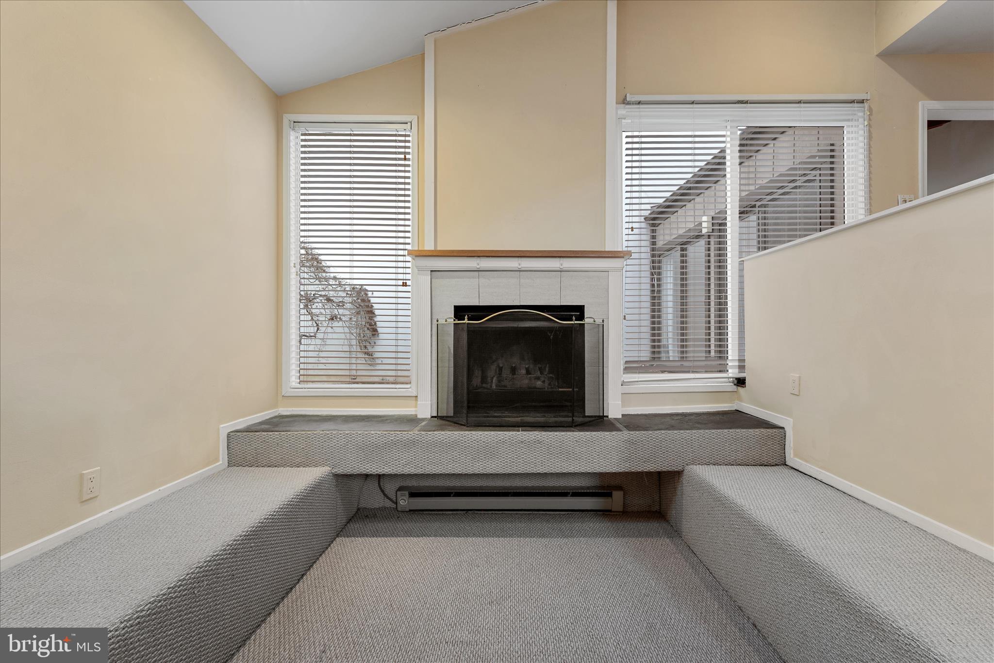 2337 Glade Bank Way Reston, VA 20191 - Photo 26 of 50 a living room with furniture and a fireplace
