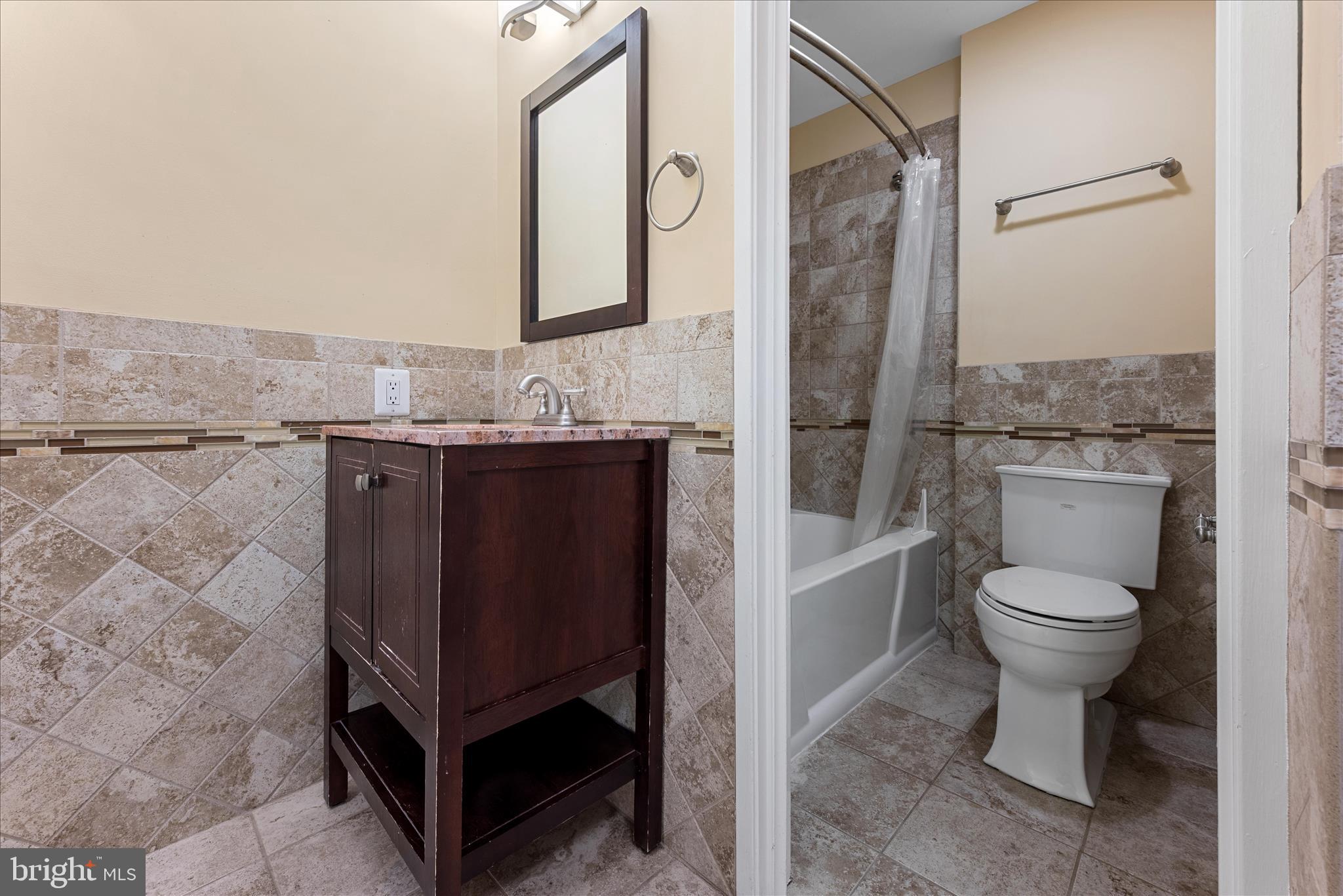 2337 Glade Bank Way Reston, VA 20191 - Photo 38 of 50 a bathroom with a granite countertop toilet sink and mirror