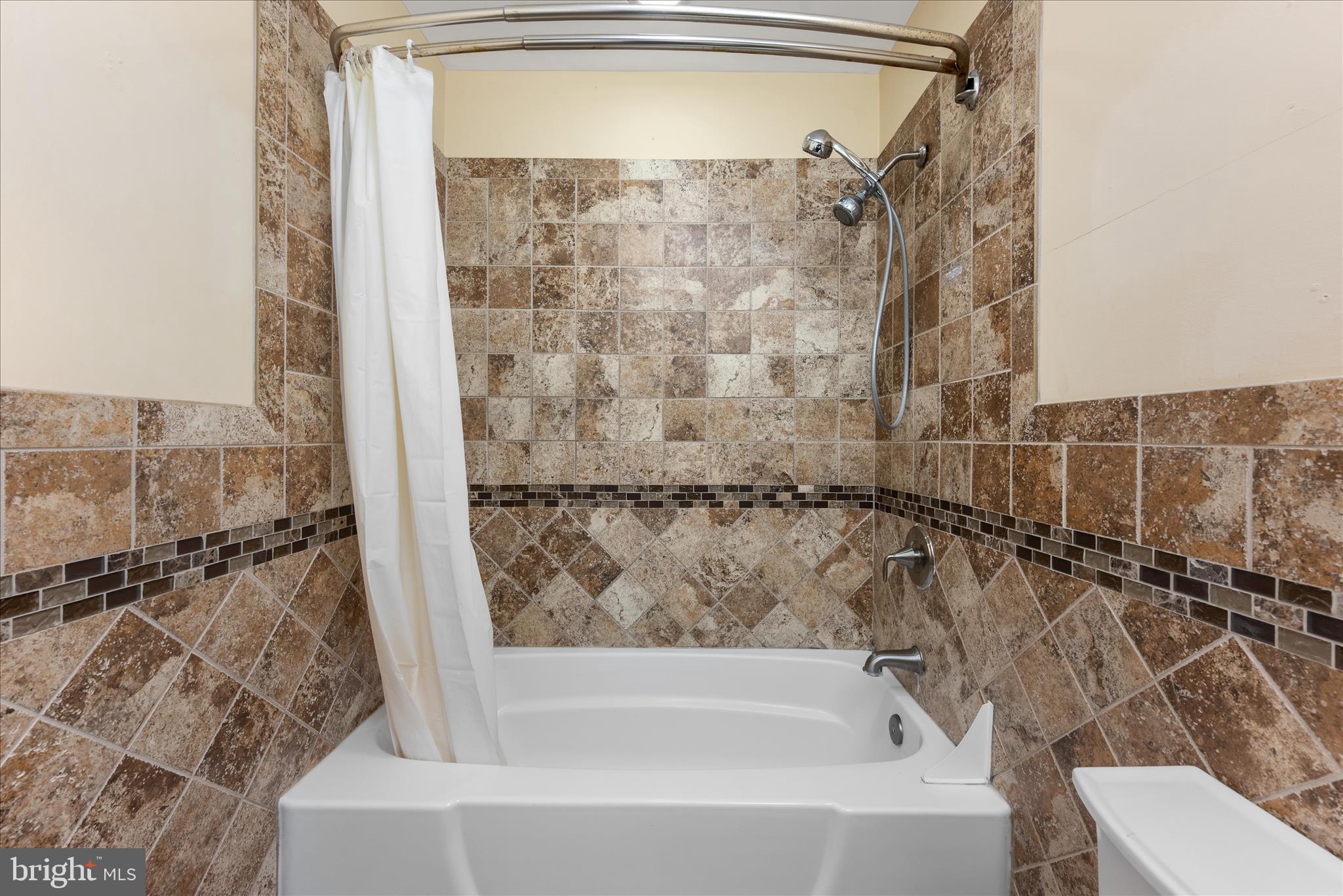 2337 Glade Bank Way Reston, VA 20191 - Photo 44 of 50 a bathroom with a bathtub and shower