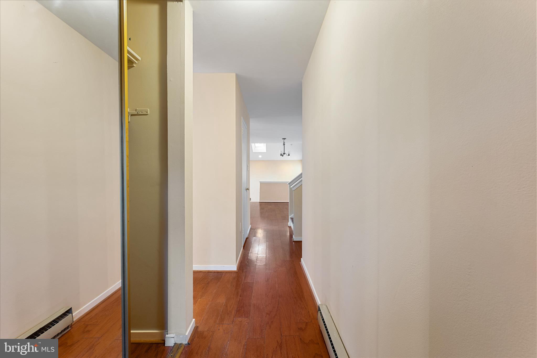 2337 Glade Bank Way Reston, VA 20191 - Photo 6 of 50 a view of a hallway with wooden floor
