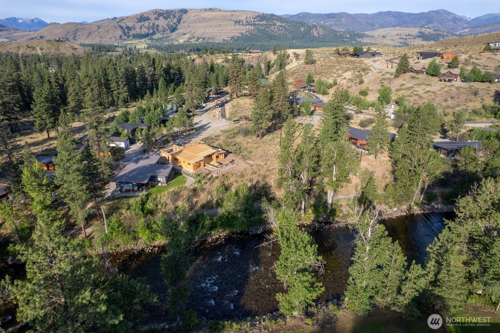 615 Pine Loop Winthrop, WA 98862 - Photo 24 of 35 an aerial view of residential house with green space and mountain view