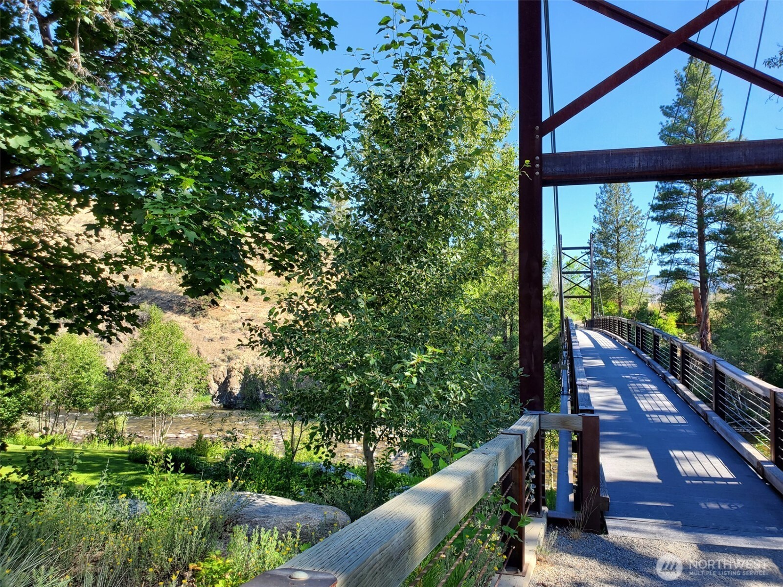 615 Pine Loop Winthrop, WA 98862 - Photo 3 of 35 a view of a balcony with wooden floor and bench