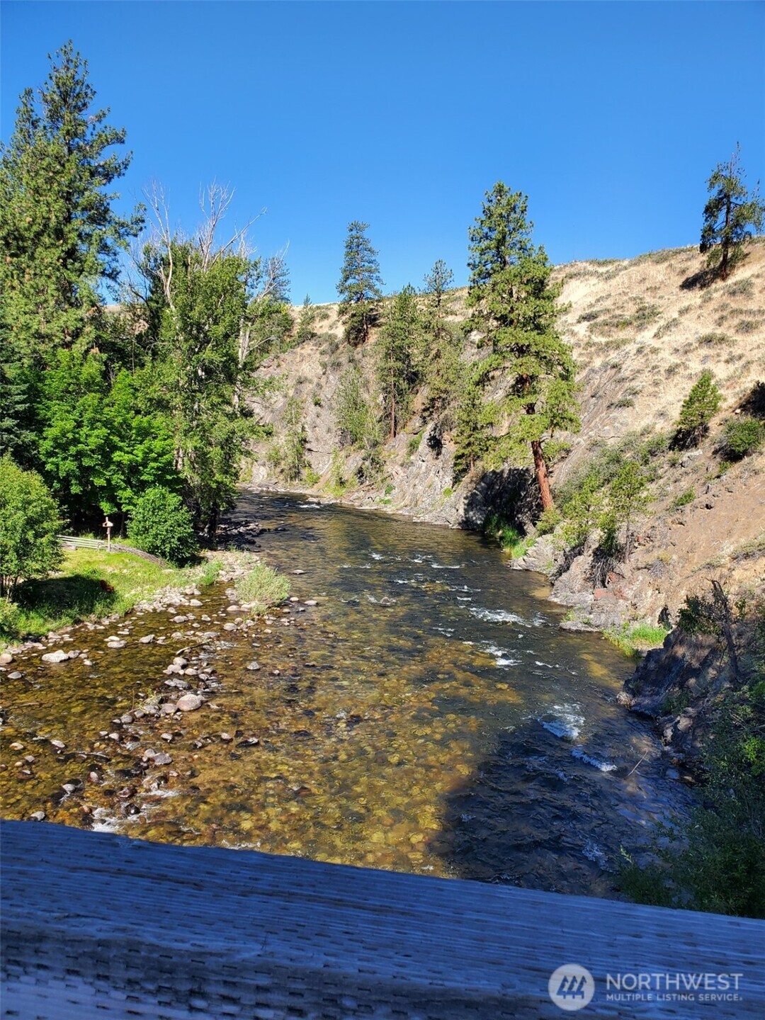 615 Pine Loop Winthrop, WA 98862 - Photo 31 of 35 a view of a yard with wooden fence