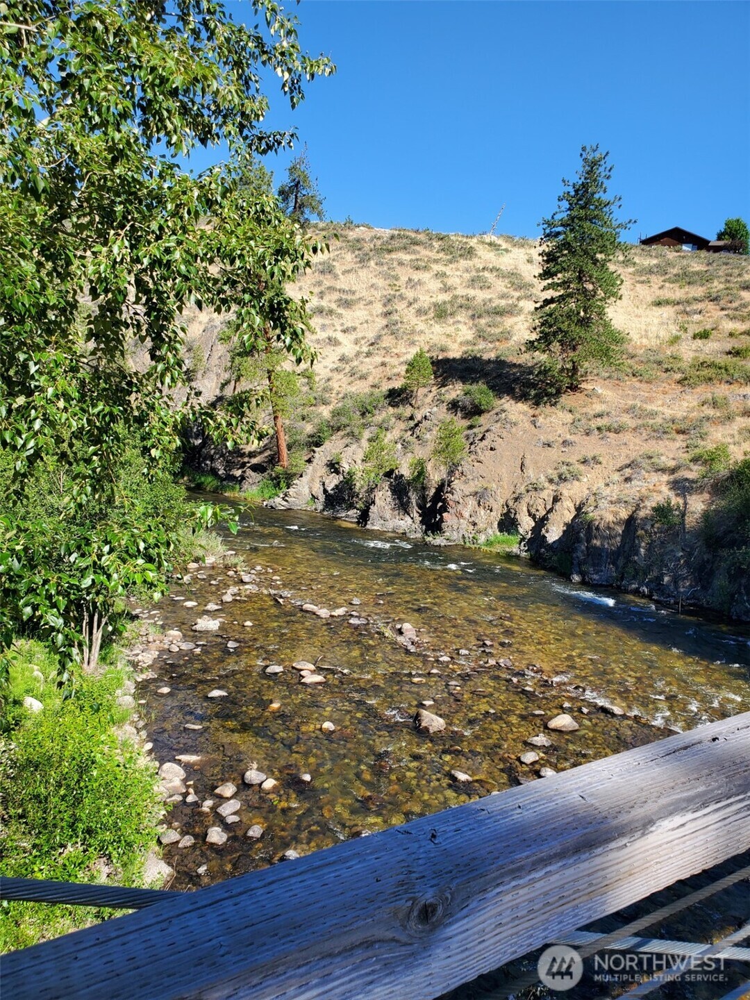 615 Pine Loop Winthrop, WA 98862 - Photo 33 of 35 a view of a lake with a mountain