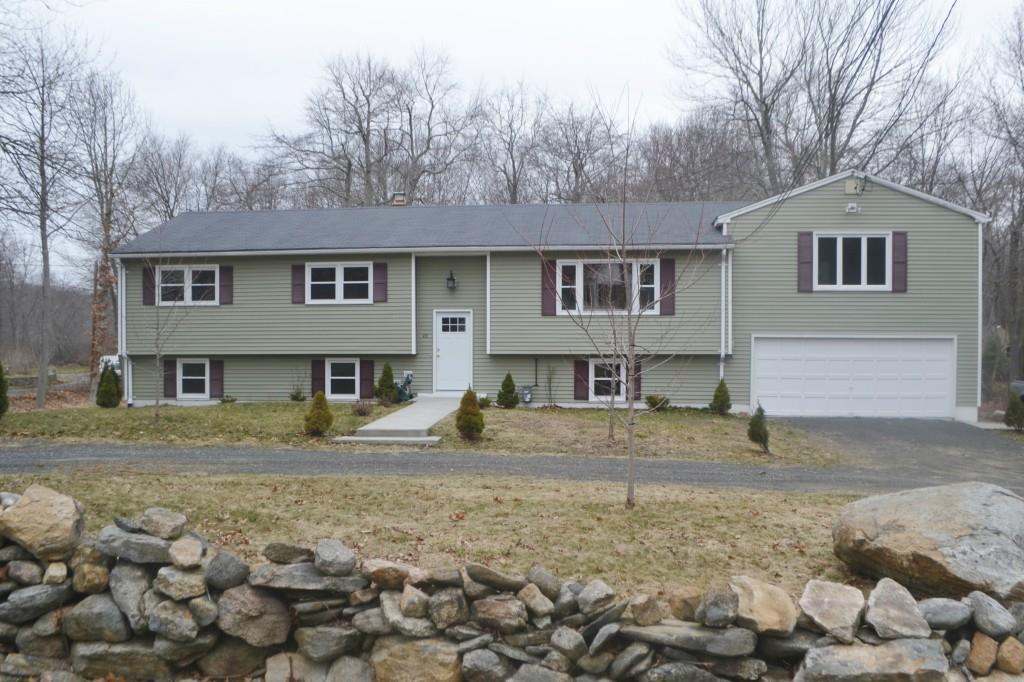 23 Brush Hill Road Clinton, CT 06413 - Photo 1 of 1 a house that has a tree in front of it