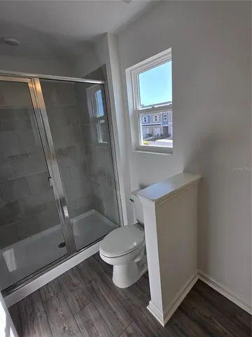 a view of a double sink and a mirror