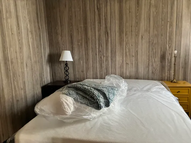 a view of a house with a yard and wooden floor