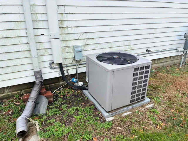 a view of a backyard with a sitting area