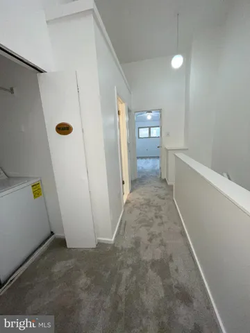 a bathroom with a shower sink vanity mirror and toilet