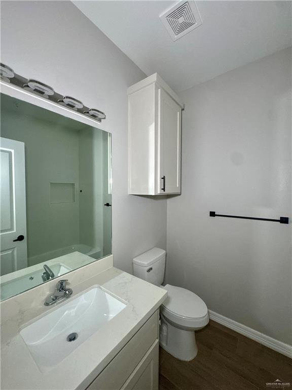720 Ragland Road, Unit 8 Mission, TX 78572 - Photo 8 of 17 a bathroom with a sink mirror and toilet