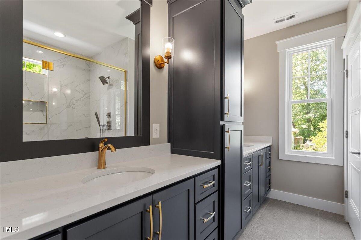3934 Old Chapel Hill Road Durham, NC 27707 - Photo 5 of 47 a bathroom with a sink and a mirror