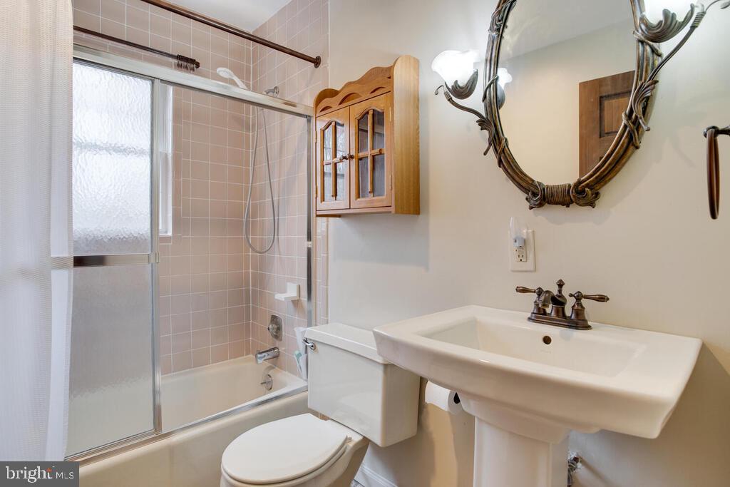 936 Grace Road Huntingtown, MD 20639 - Photo 23 of 64 a bathroom with a sink toilet and shower