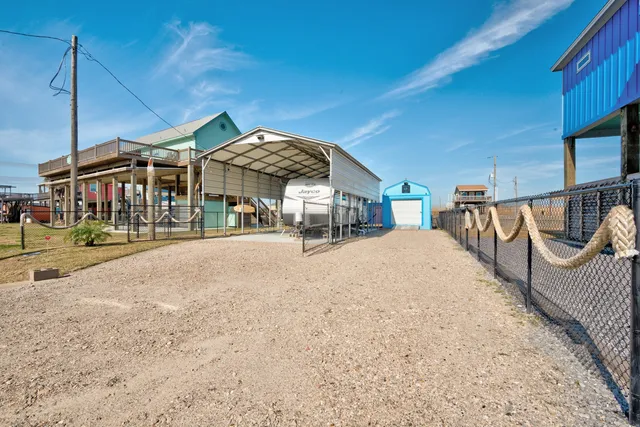 a wooden bench sitting in front of a building
