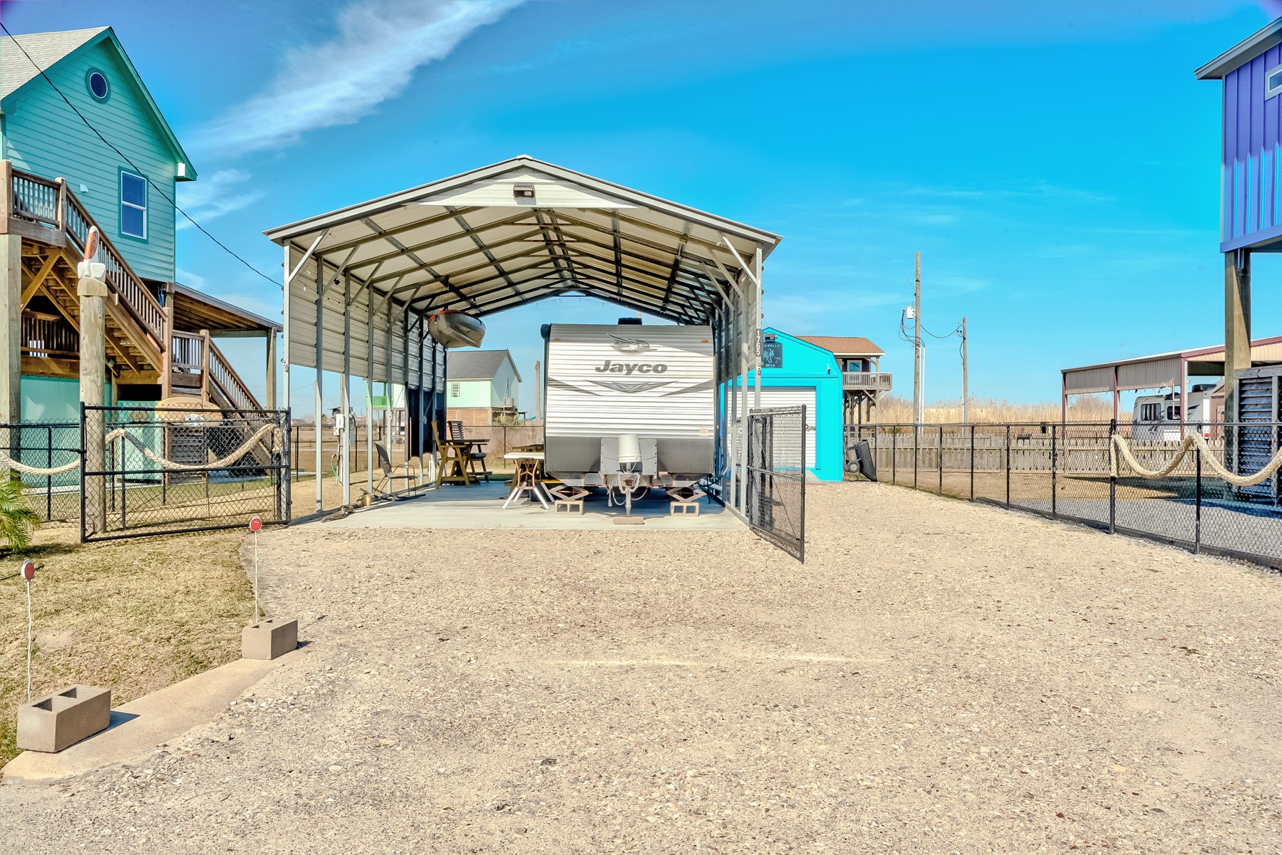 1765 Croaker Lane Crystal Beach, TX 77650 - Photo 3 of 17 a view of a house with wooden roof