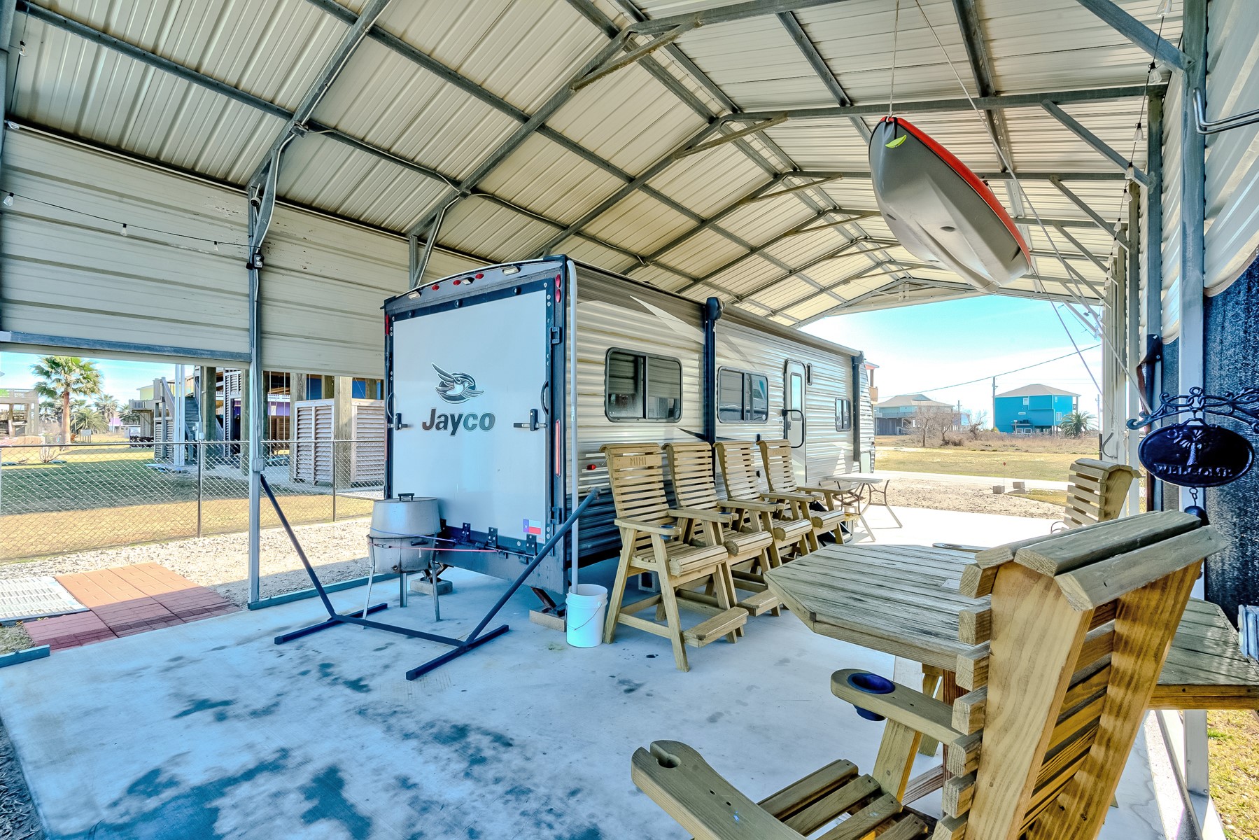 1765 Croaker Lane Crystal Beach, TX 77650 - Photo 8 of 17 a view of a patio with a table chairs and a patio