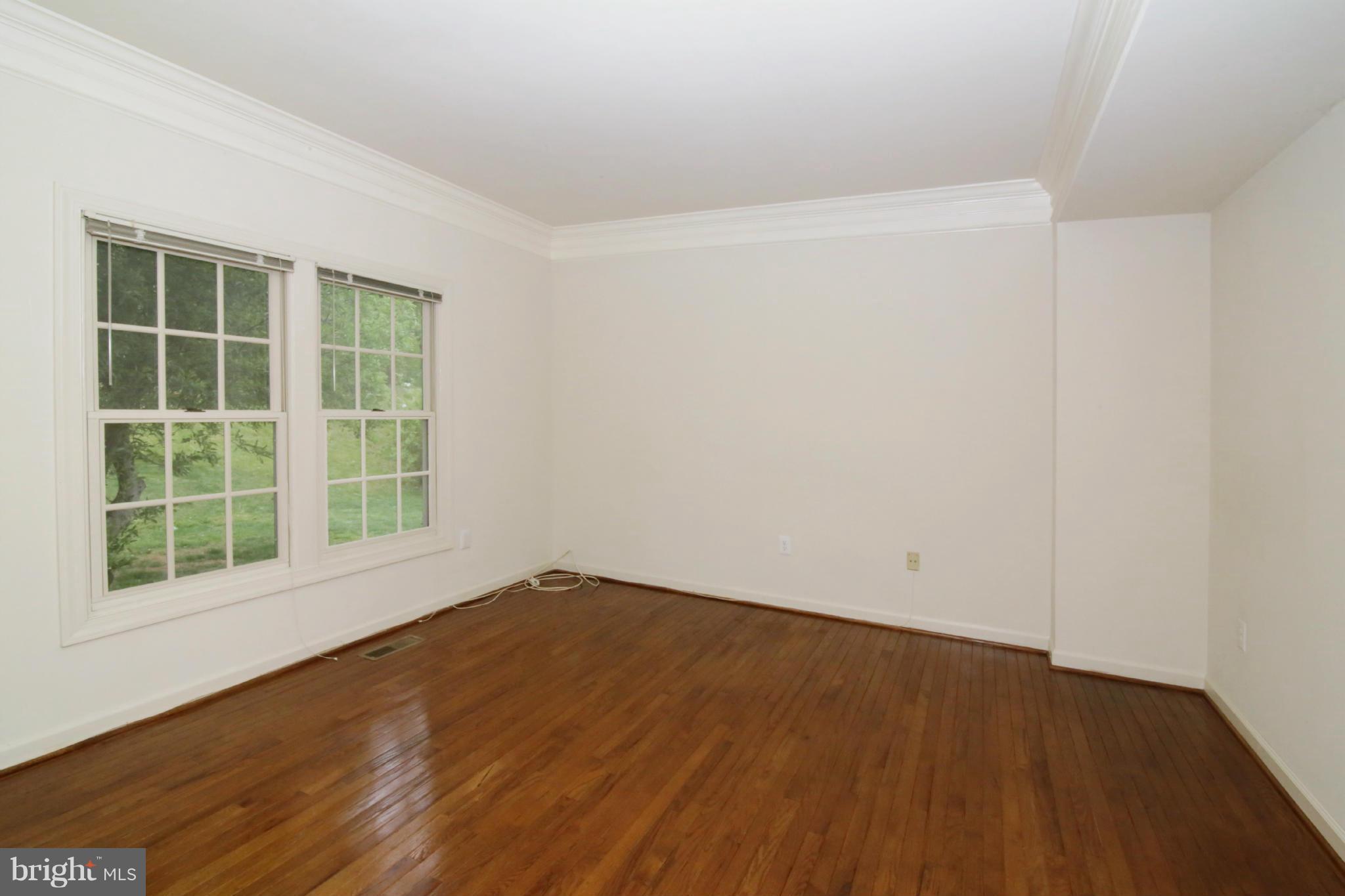 5483 Ashleigh Road Fairfax, VA 22030 - Photo 13 of 30 wooden floor in an empty room with a window