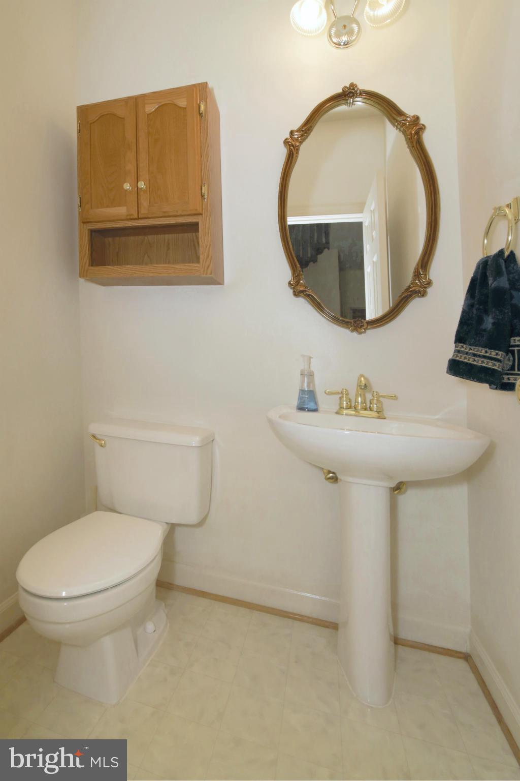 5483 Ashleigh Road Fairfax, VA 22030 - Photo 14 of 30 a bathroom with a toilet sink and mirror
