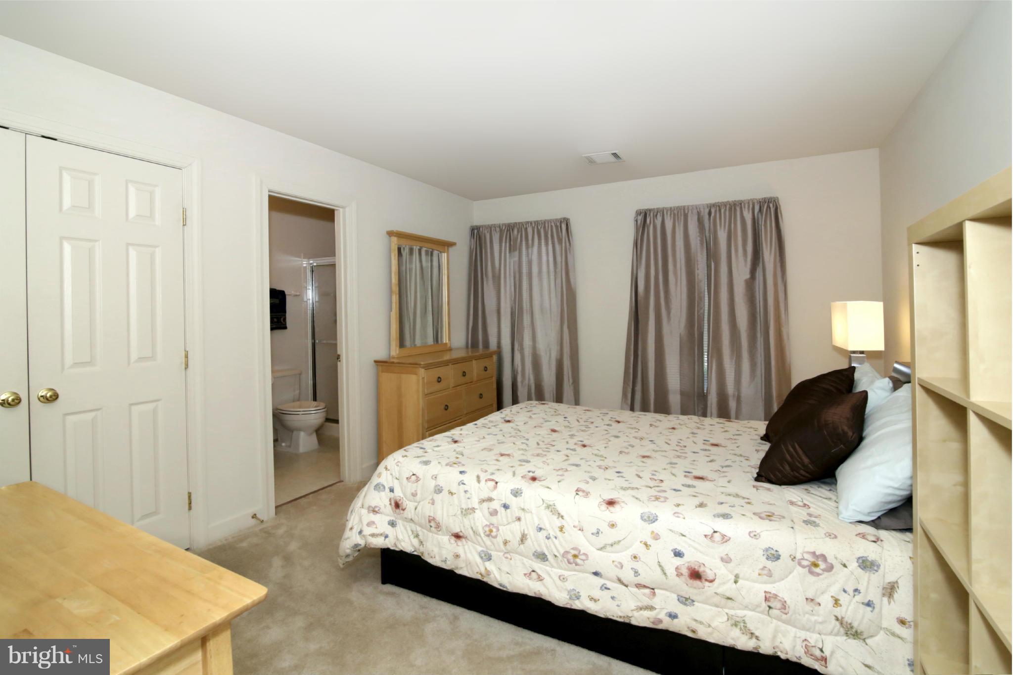 5483 Ashleigh Road Fairfax, VA 22030 - Photo 20 of 30 a bedroom with a bed and a dresser