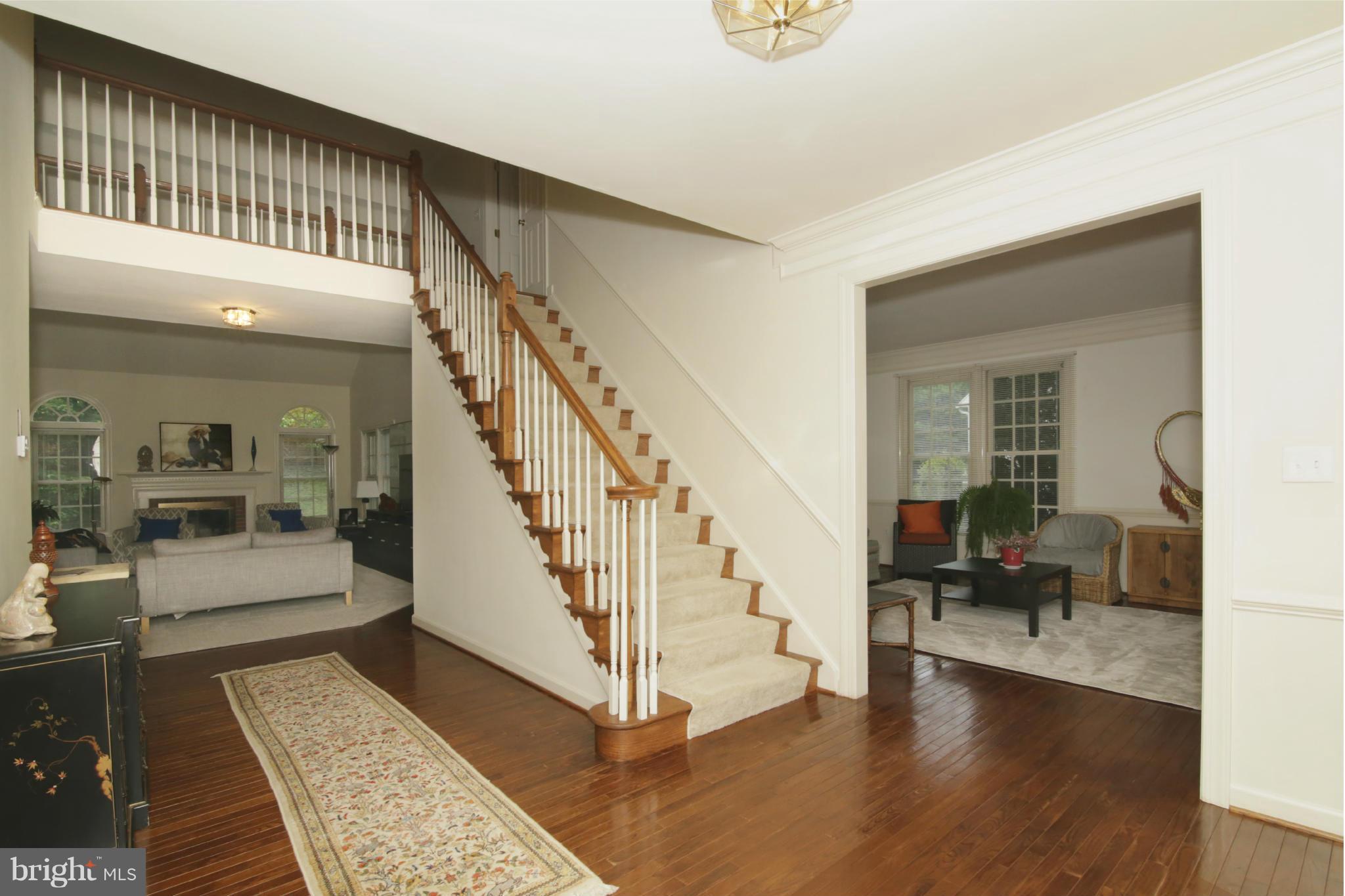5483 Ashleigh Road Fairfax, VA 22030 - Photo 3 of 30 a view of an entryway with wooden floor and a livingroom