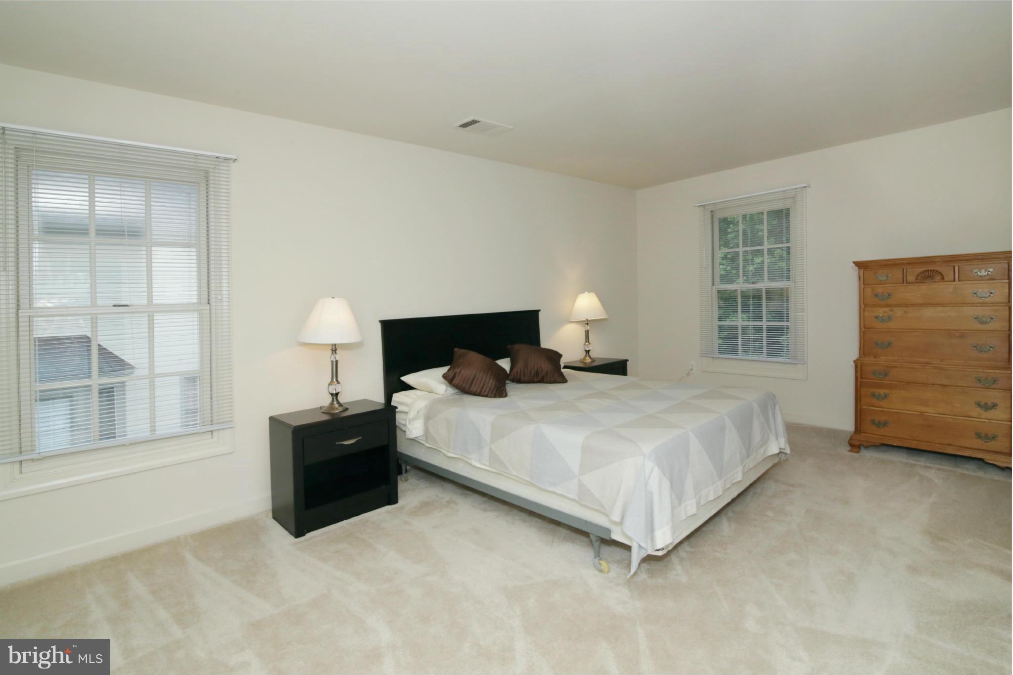 5483 Ashleigh Road Fairfax, VA 22030 - Photo 22 of 30 a bedroom with a bed and dresser