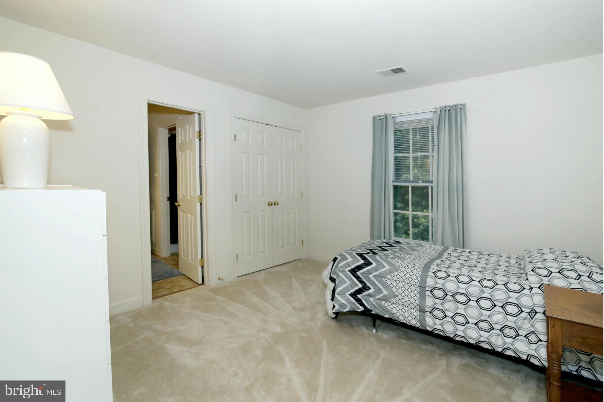 5483 Ashleigh Road Fairfax, VA 22030 - Photo 23 of 30 a bedroom with a bed and a window