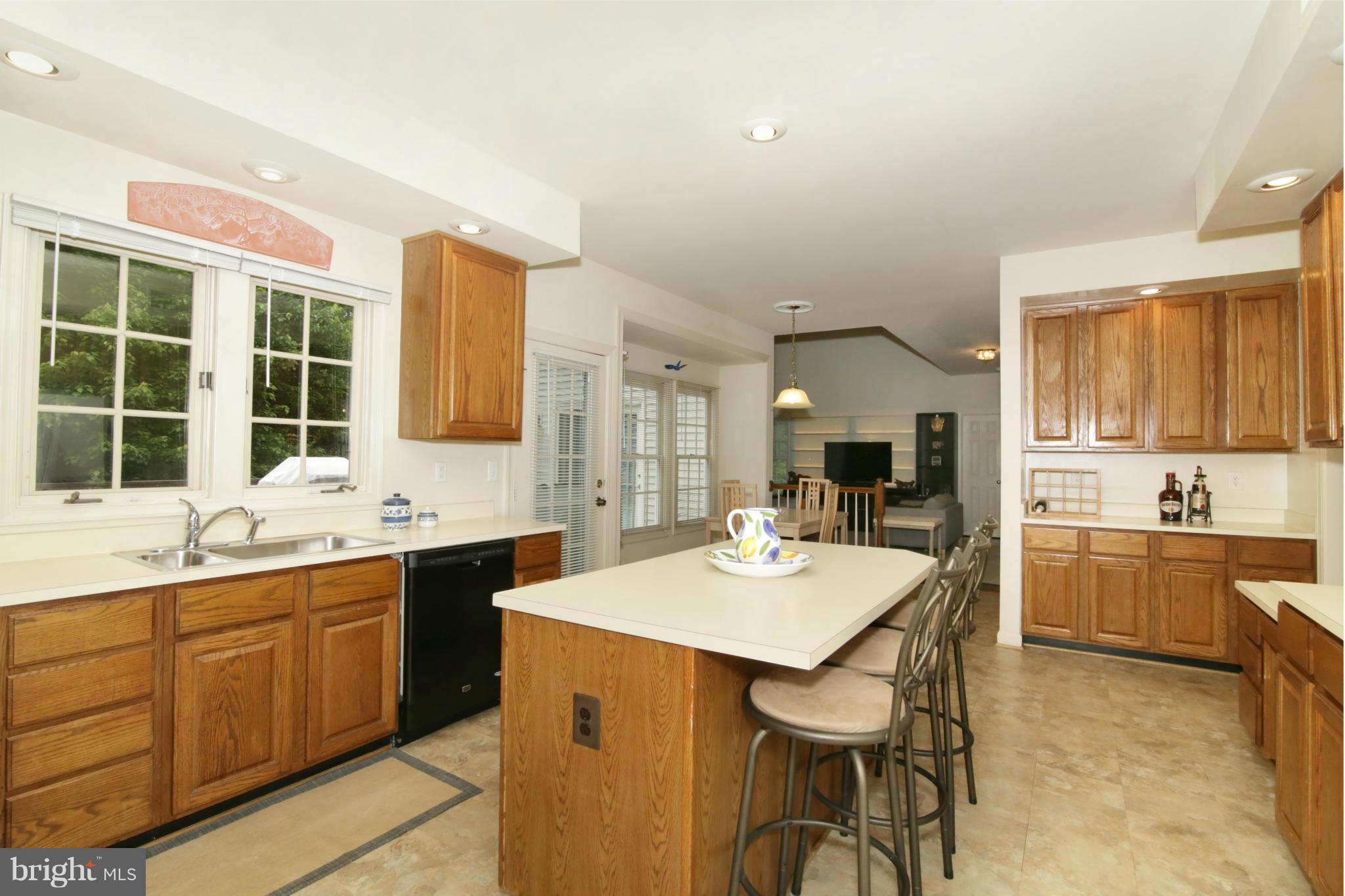5483 Ashleigh Road Fairfax, VA 22030 - Photo 7 of 30 a kitchen with a sink stove and cabinets