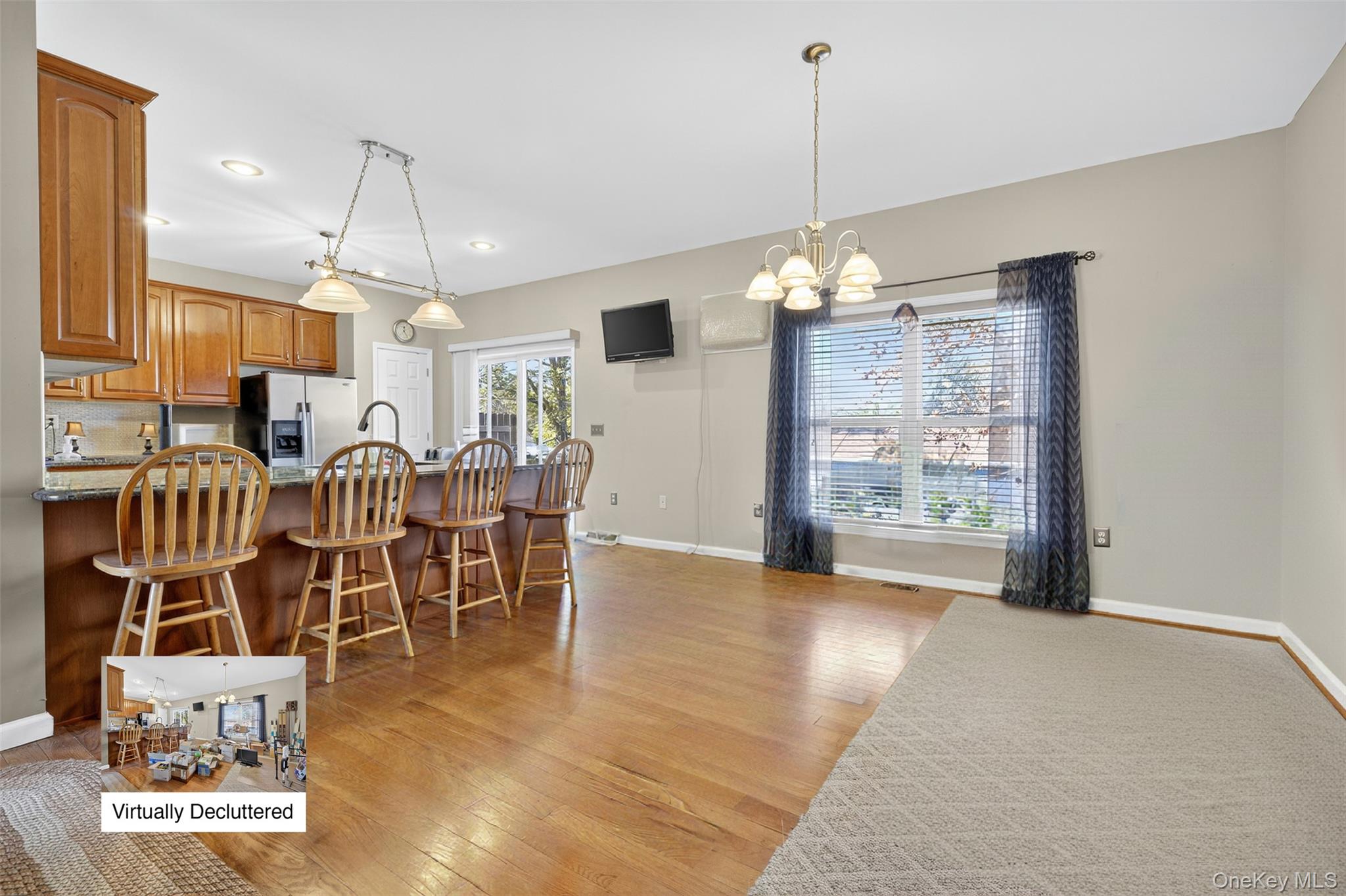 99 Dusinberre Road Gardiner, NY 12525 - Photo 4 of 24 a view of a dining room and livingroom with furniture wooden floor a chandelier