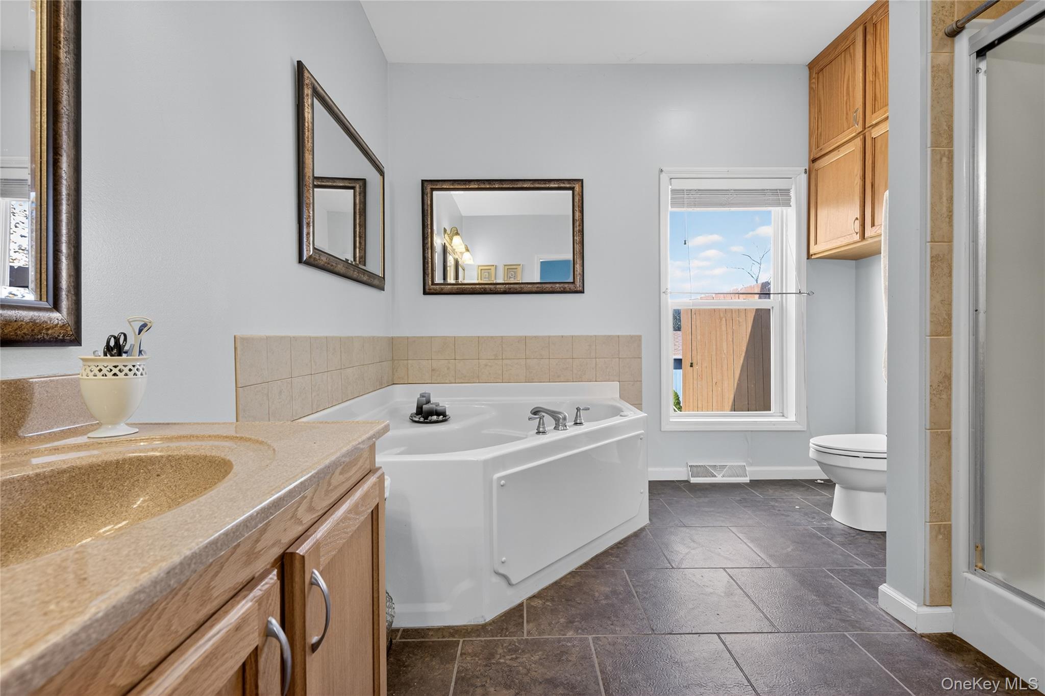 99 Dusinberre Road Gardiner, NY 12525 - Photo 7 of 24 a bathroom with a sink a toilet and bathtub