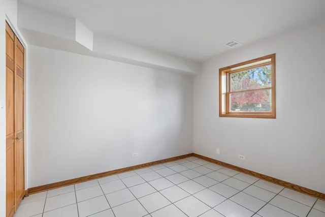 a view of an empty room with windows