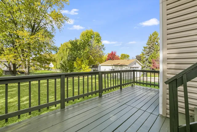 a view of balcony with wooden floor