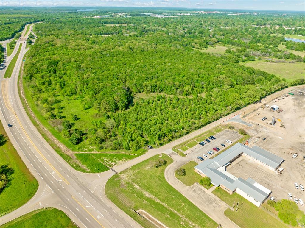 286 Southwest Loop 286 Paris, TX 75460 - Photo 4 of 17 a view of a swimming pool with a garden