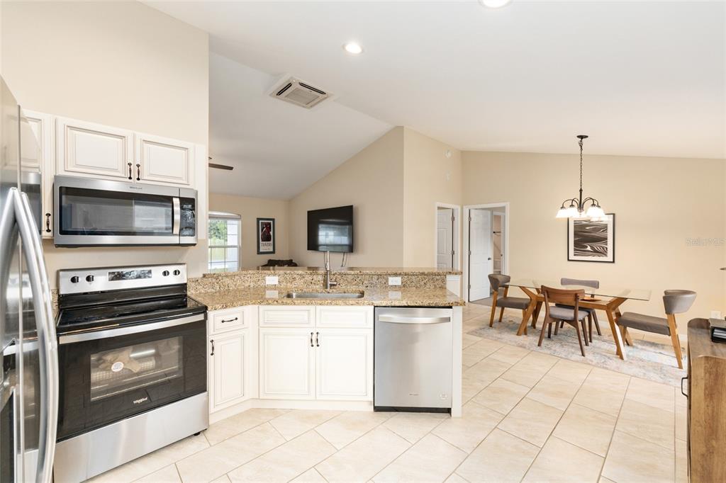 16779 Southwest 17th Avenue Ocala, FL 34473 - Photo 12 of 34 a kitchen with appliances cabinets and furniture