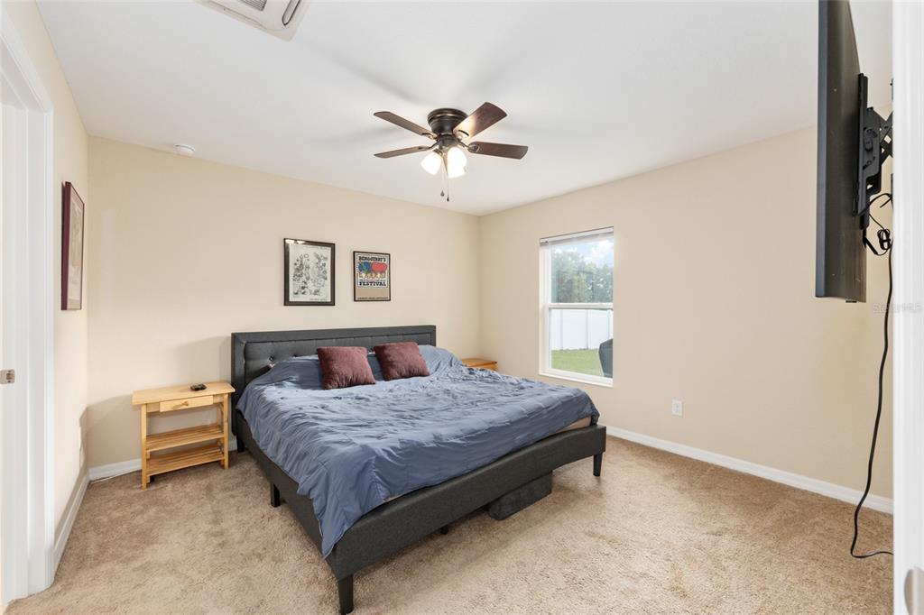 16779 Southwest 17th Avenue Ocala, FL 34473 - Photo 13 of 34 a bedroom with a bed and a window