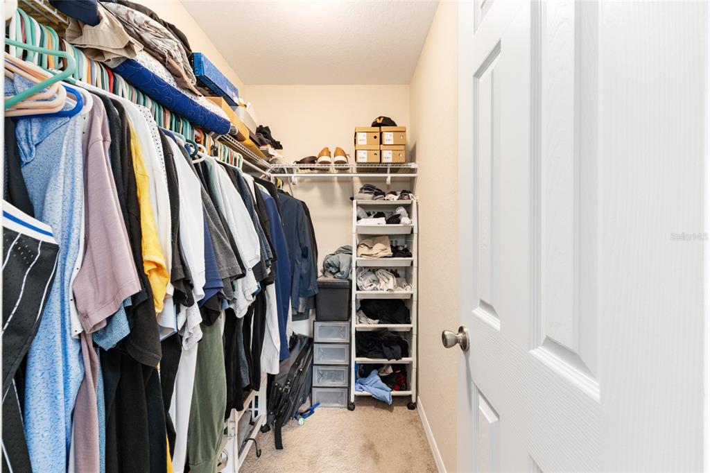 16779 Southwest 17th Avenue Ocala, FL 34473 - Photo 17 of 34 a view of walk in closet with clothes and shoes