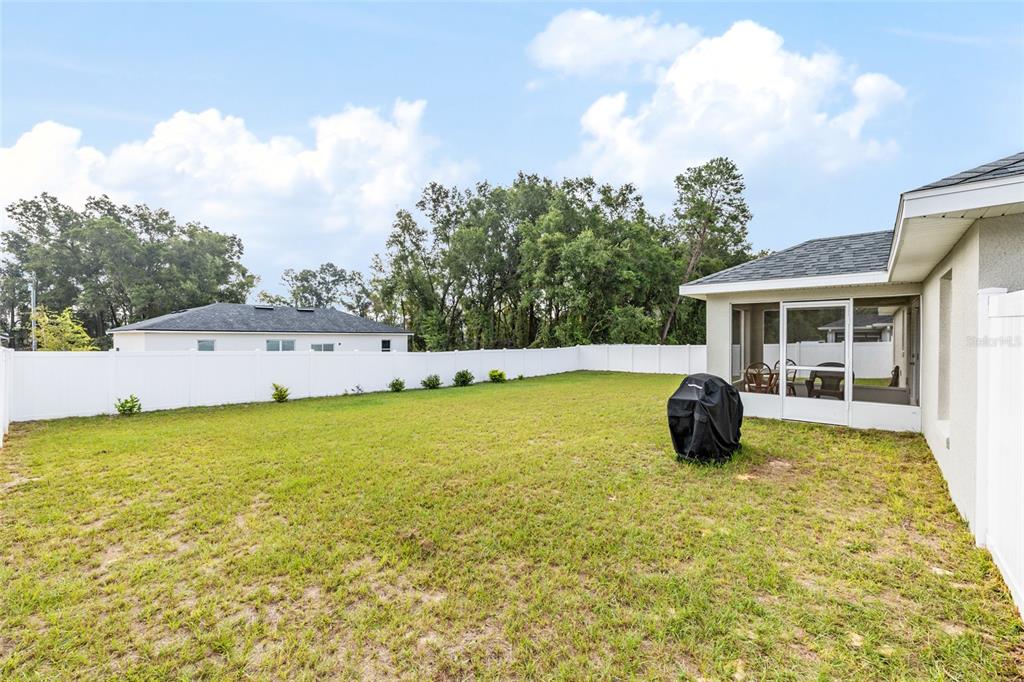 16779 Southwest 17th Avenue Ocala, FL 34473 - Photo 27 of 34 a view of an house with swimming pool and porch
